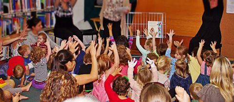 children at a library for story time - connecting through storytelling