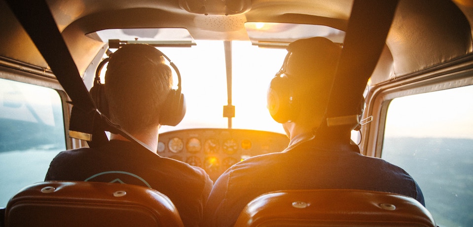 a pilot and his co-pilot to depict how you need both to fly a plane