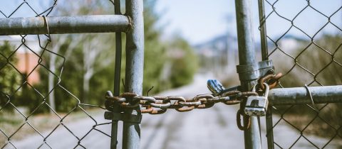 Two gates that are locked up to represent gated content